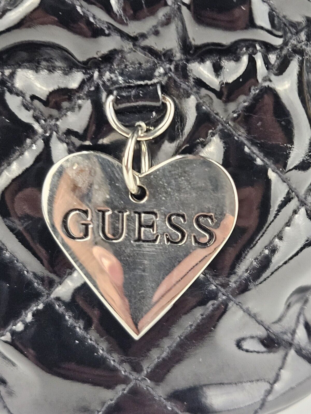 Guess vintage black cosmetic pouch travel bag with metal heart logo