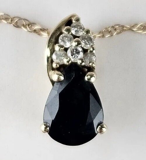 14k Yellow Gold Black Star Sapphire and Natural Diamond Accent Pendant